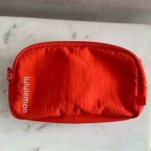 Lululemon mini everywhere belt bag. NEW. Never used. Solar orange. Rare color.